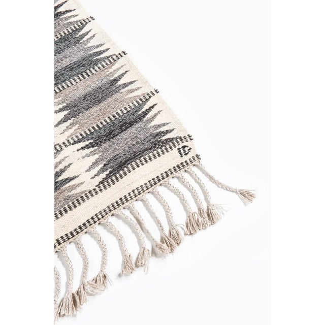 This piece is a rug designed by Ingrid Dessau and produced in Sweden. This piece has an attribution mark, I am sure that...