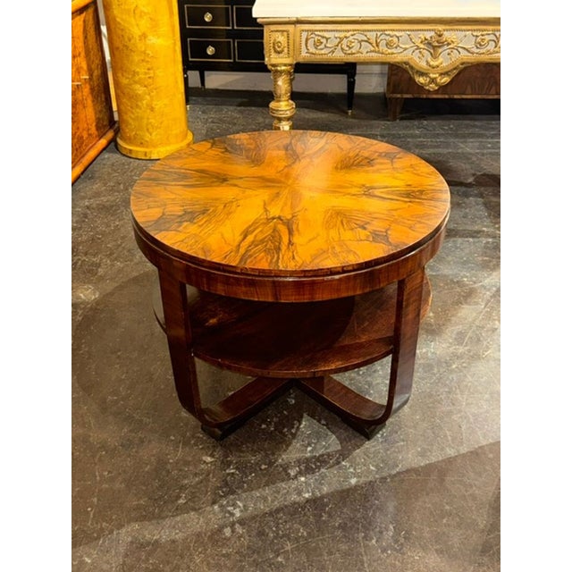 The French Art Deco Black Walnut Side Table is a stylish and elegant piece of furniture that adds a touch of...
