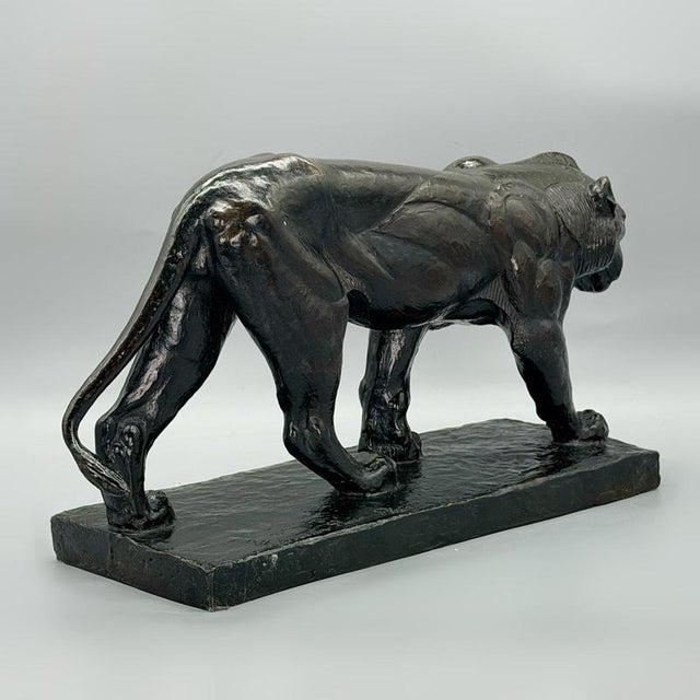 An impressive and rare patinated bronze sculpture by Piero Palazzolo of a prowling lion. Excellent hand chased detail with...