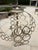Classic Currey & Co. orb chandelier. Style discontinued in 2025 - and now hard to find. Rows of rings, open orb style....
