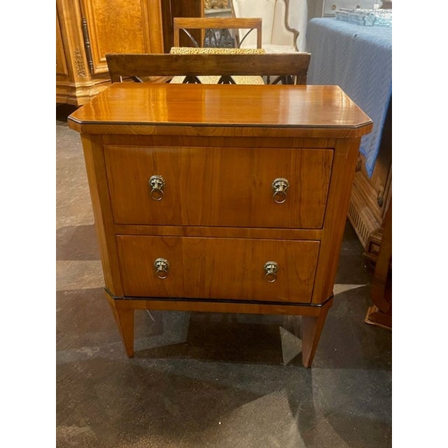 This product is a 19th century German Biedermeier walnut side table, showcasing the traditional and intricate...