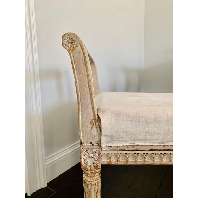 Gustavian original stool dating from around 1850. Padded seat with raw muslin cover. The legs and base contain intricate...