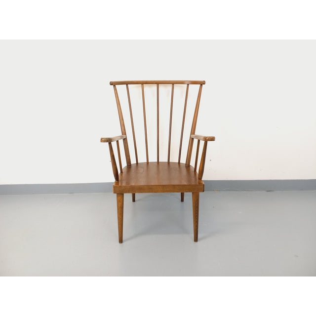 Vintage 1960s armchair in beech wood, by Baumann, Belvoir model, commonly known as the Fan model, produced from 1965...