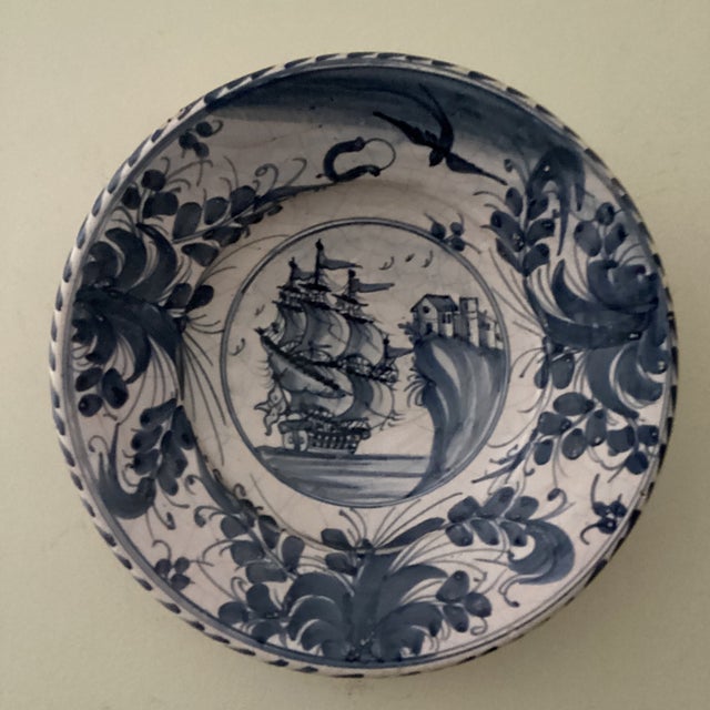 This 18th century tin-glazed ceramic Galleon sailing ship wall decor plate by Delft is a antique handmade piece...