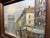 Impressionist oil painting depicting a Paris street scene with the Arc de Triomphe, signed by Caroline C. Burnett.