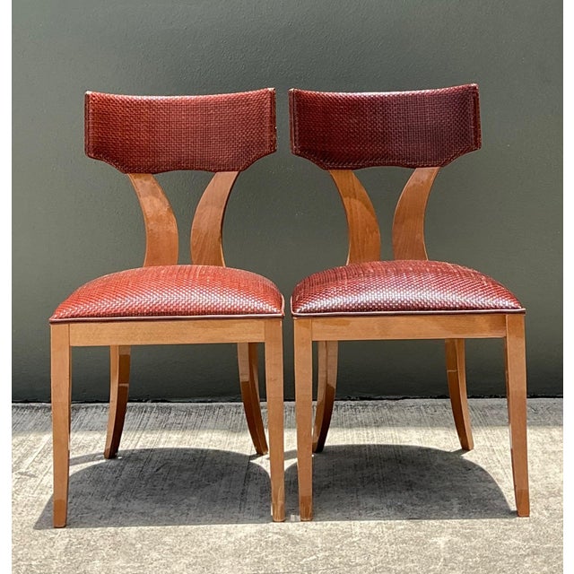 This elegant pair of vintage dining chairs exemplifies the understated sophistication of mid-century craftsmanship,...