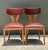 This elegant pair of vintage dining chairs exemplifies the understated sophistication of mid-century craftsmanship,...