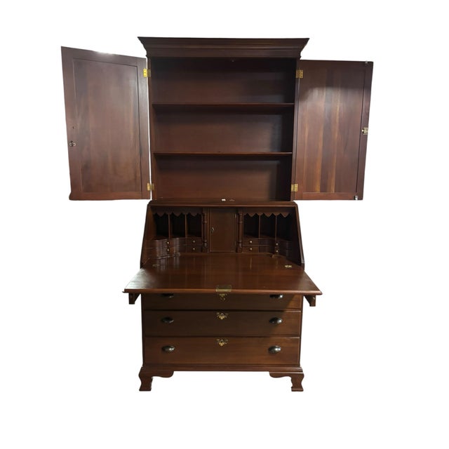 Classic American craftsmanship meets timeless functionality in this handsome Colonial Revival mahogany secretary desk and...