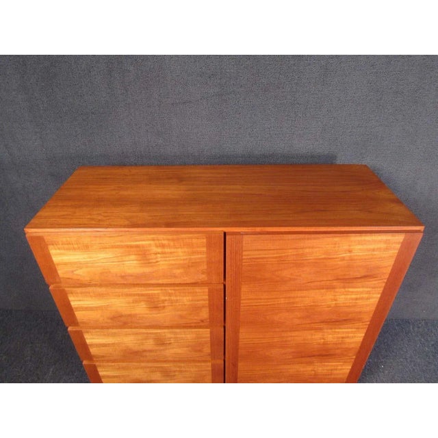 With a rich and vibrant woodgrain, this vintage Danish dresser is impressive and understated. A staple piece for any...