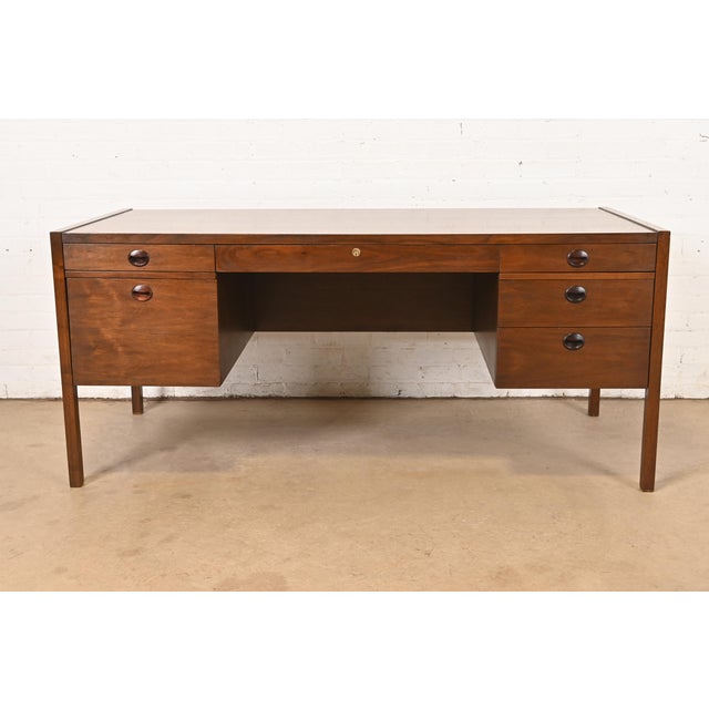 An exceptional Mid-Century Modern executive desk By Edward Wormley for Dunbar Furniture USA, Circa 1960s Gorgeous walnut,...