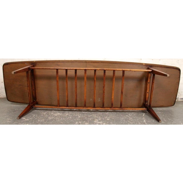 Mid 20th Century Walnut Surfboard Coffee Table With Spindled Shelf For Sale - Image 4 of 8