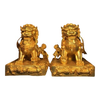 Pair of Gilt Bronze Guardian Lions – 7.9" Foo Dogs on Dragon Relief Bases With Xuande Mark For Sale