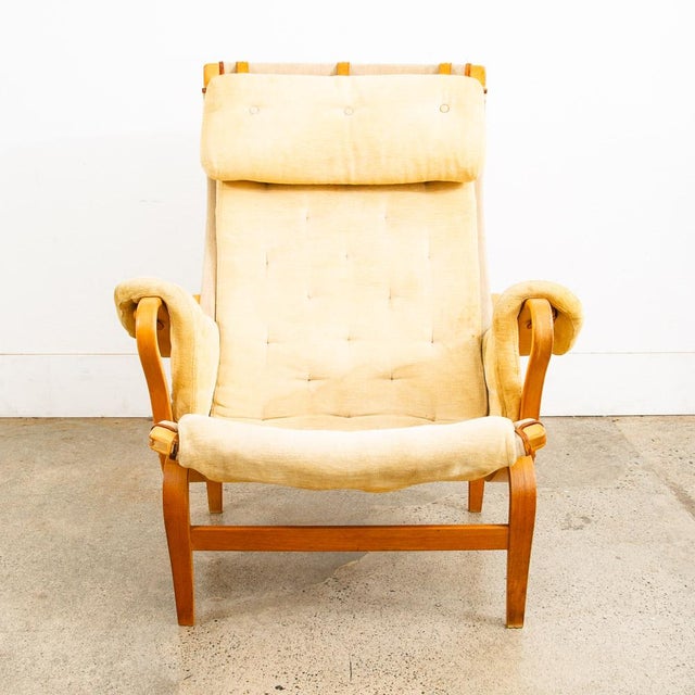 Iconic natural tan leather "Pernilla" armchair/ Lounge chair designed by Bruno Mathsson. The first version was designed in...