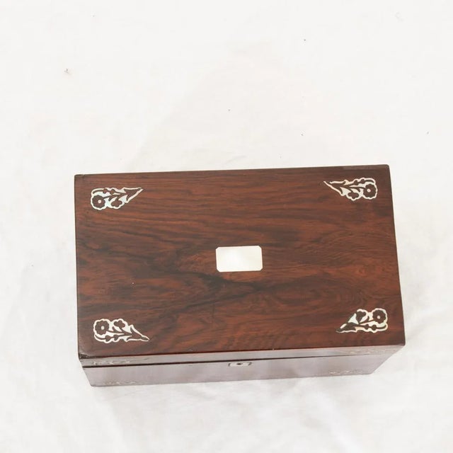 An English 19th century decorative box with lid opening on original brass hinges to reveal a good sized storage...