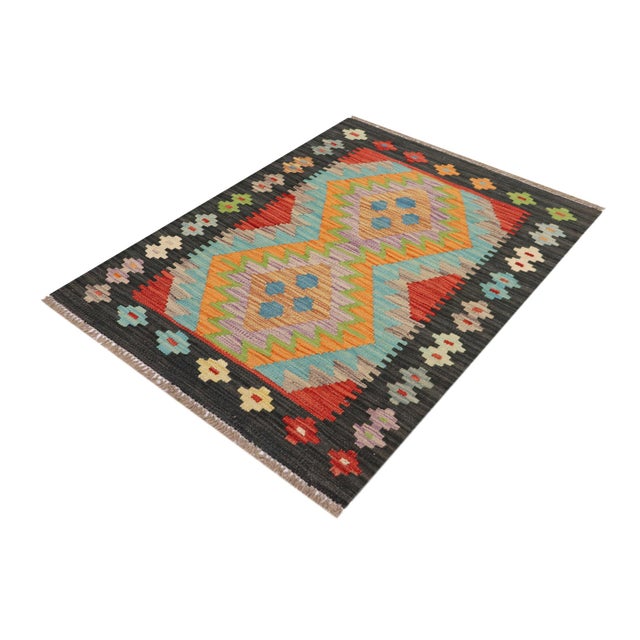 Elevate the elegance of your home with this stunning hand-woven tribal Kilim wool rug. Meticulously crafted on a loom by...