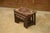 A stunning trio of nesting tables, typical of the brutalist aesthetic of the 1960s. The wooden structure is punctuated by...