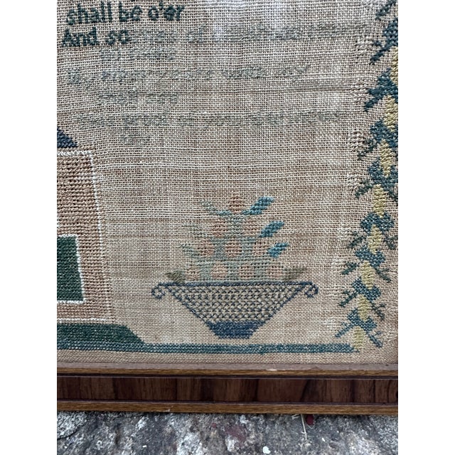 Highlighted by exceptionally vibrant hues of blues, greens, and mustards, this c1820s schoolgirl sampler wrought by 12...