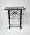 A very nice beveled marble topped console table with handcrafted sculptural black iron base having twisted and curved...