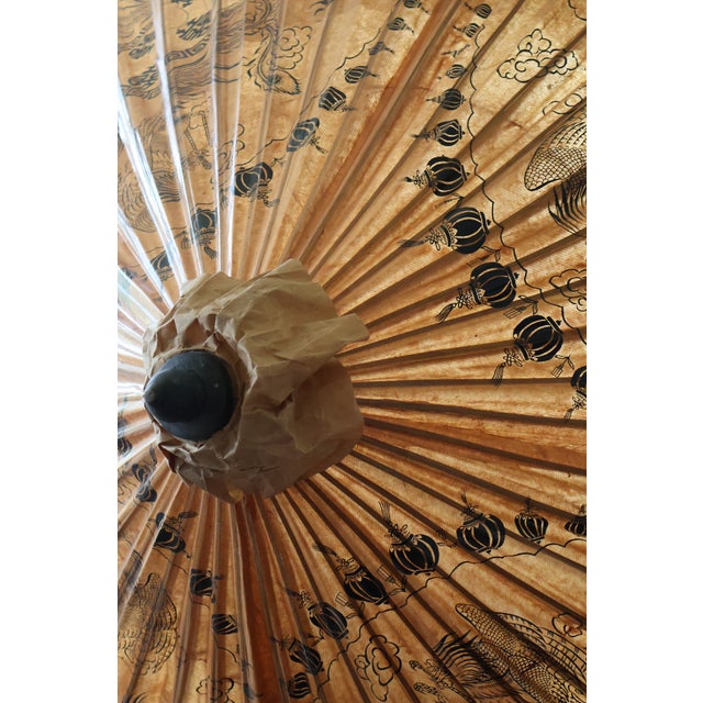 A spectacular matched pair of extra-large vintage Chinese oil-paper parasols, each opening to an estimated six-and-a-half-...