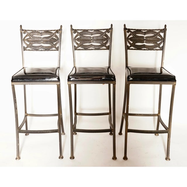 Mid Century Modern Montecristo Style Bar Stools with a beautiful vintage metal frame and black patent leather upholstered...