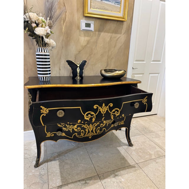Vintage European hand-painted commode in an elegant French/Italian baroque style. This statement piece features a...