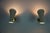 This pair of mid-century modern brass diabolo wall lamps, crafted in germany in the 1950s, embodies the elegance and...