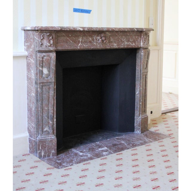 This mantel was salvaged from the Waldorf Astoria Hotel and is carved from Rouge Royale, a rich oxblood marble...