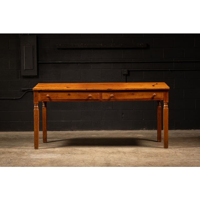 Oak arts & crafts-style writing desk with two drawers. This traditional desk was part of the movement that came from a...