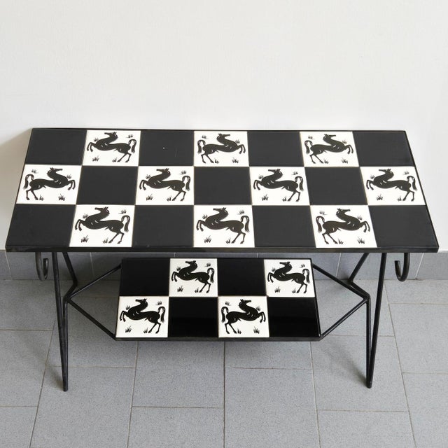 In fair condition, some tiles are more worn than others, especially where exposed to strong light; there is a chip on one...