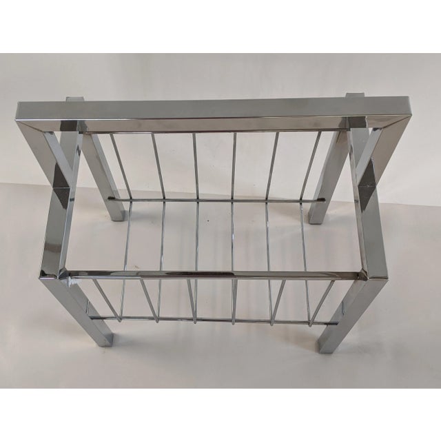 Magazine rack is in excellent condition. Chrome is bright and shiny. Nice clean lines would make a great addition to any...