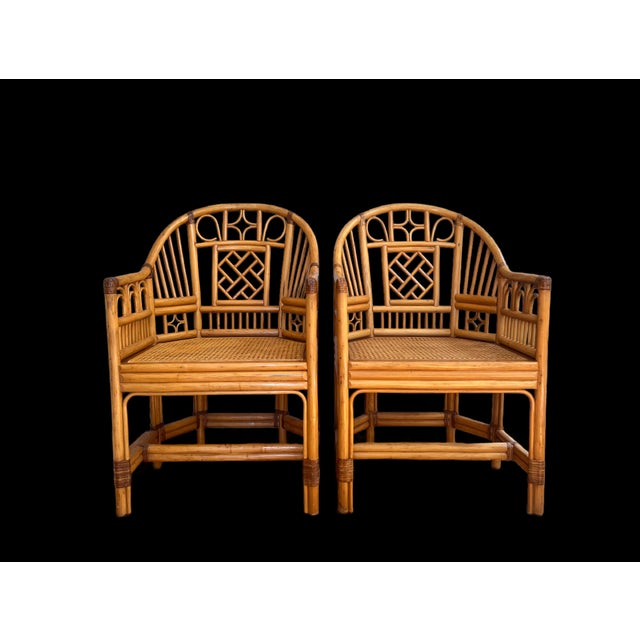 A beautiful pair of Brighton Pavilion style side chairs with cane seats in excellent condition. These could be McGuire....