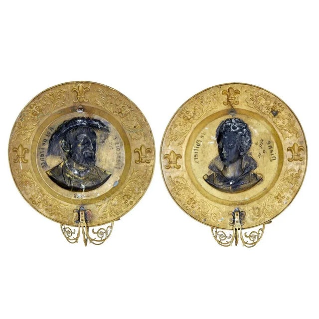 pair of 19th century french brass sconces circa 1890. good quality pair of decorative plaques that depict 2 prominent...
