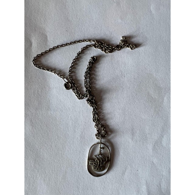 Vintage Sterling silver necklace with a multi-masted sailing ship pendant inside an open oval wire frame. Pendant Style:...