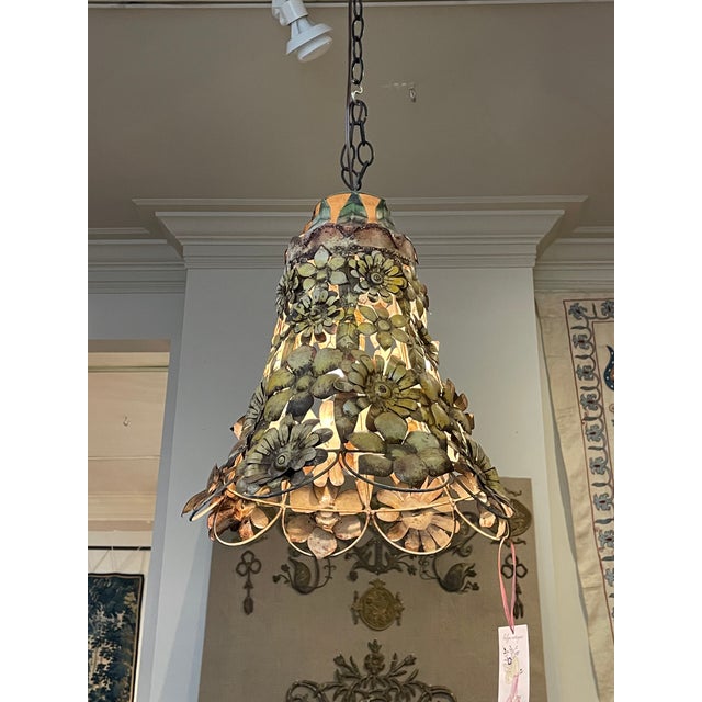A super funky tole pendant light with yellow petaled flowers applied to a bell shaped frame. The flowers are of various...