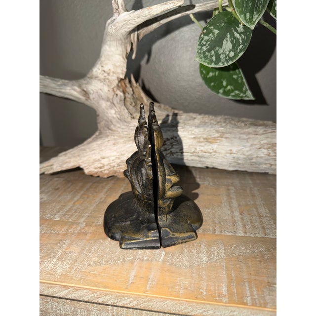 This charming matching pair of vintage cast iron Spanish galleon bookends brings classic nautical flair to any bookshelf,...