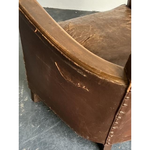 This pair of vintage French Art Deco lounge chairs is a soulful tribute to early 20th-century European design. Featuring a...