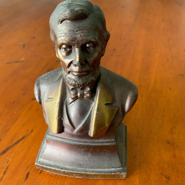 Small brass figure of Abraham Lincoln with good patina. Circa Mid 20th Century.
