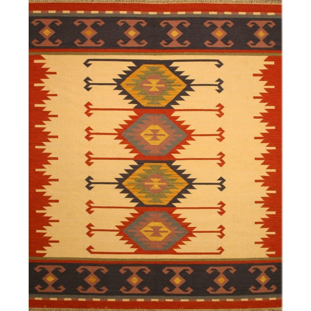 Timeless Kilim Multicolor Flatweave Wool Rug, Country of Origin: India. This exceptional flatweave piece showcases the...
