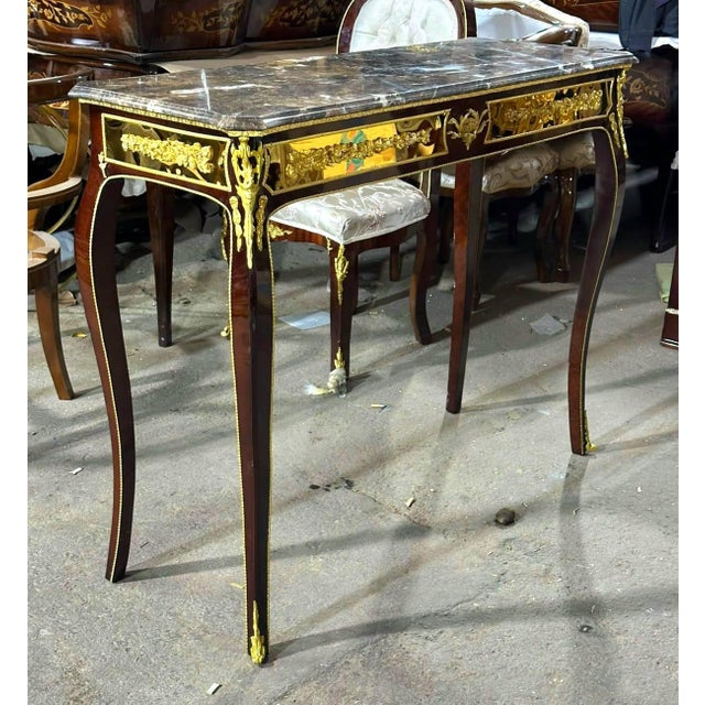 Bring refined French elegance into your home with this exquisite Louis XV-inspired console table. Expertly handcrafted...