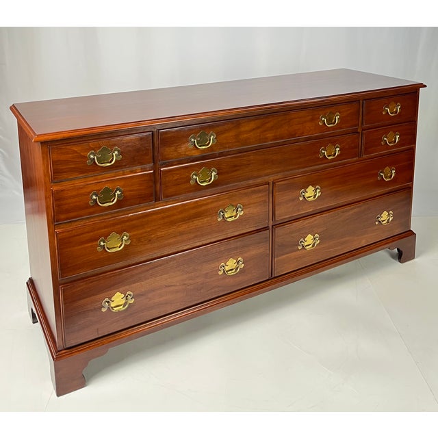 Crafted by renowned high-end maker Henkel Harris, this traditional Chippendale-style triple dresser offers exceptional...