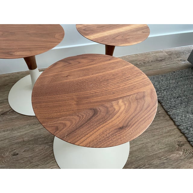 Post-modern Patty Johnson for Keilhauer trio of “Turn” walnut wooden accent tables. Patty Johnson is a Toronto-based...