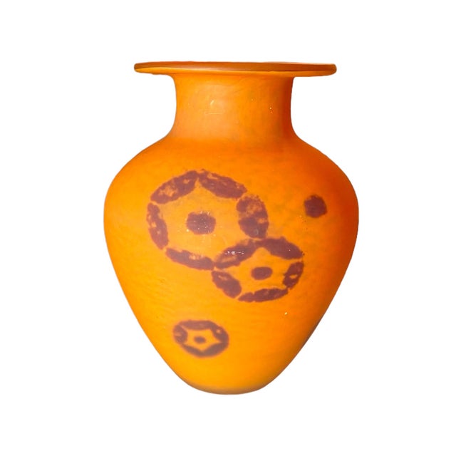 An urn shaped art deco vase by Daum Nancy circa 1930. Orange pâte de verre matte glass with circular star shapes in an...