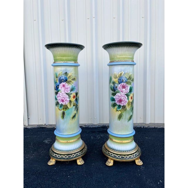 Two identical and visually stunning Capodimonte style flower painted porcelain pedestals or planter stands. Each stands...