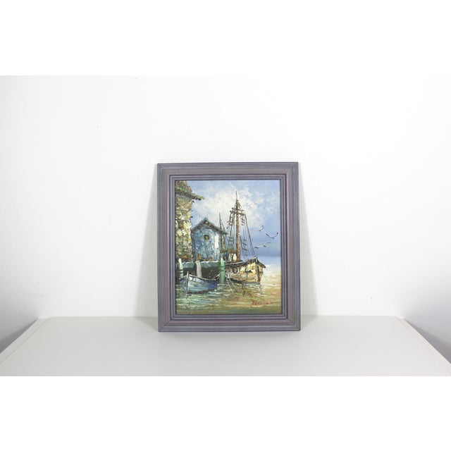 Fabulous nautical scene of a marina or dock with boats. The painting is in great vintage condition. It is signed on the...