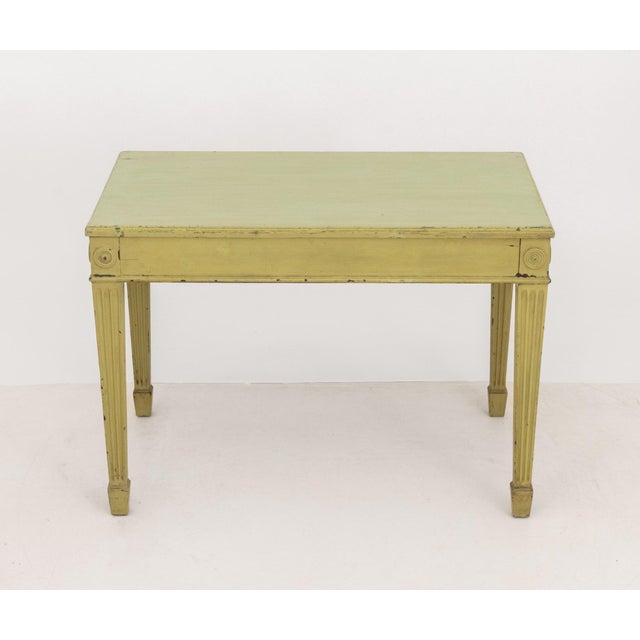 Neoclassical Style Green Painted Console Table, with rosettes and four fluted tapered legs. 29.5" H x 42" W x 25.75" D....