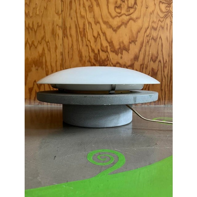 Concrete and marble table lamp, late 1970s / early 1980s A sculptural lamp composed of a solid base in smooth concrete and...