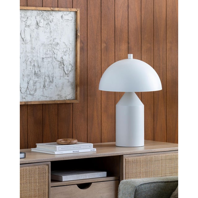 Illuminate your space with the Elder accent table lamp, a striking blend of industrial rustic charm that will captivate...