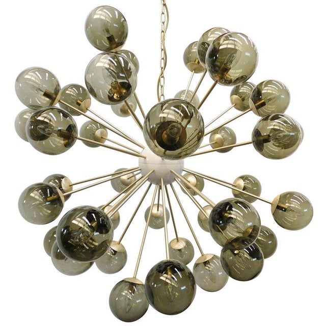 Italian sputnik chandelier with 40 smoky Murano glass globes mounted on brass frame in satin brass finish / Made in Italy...