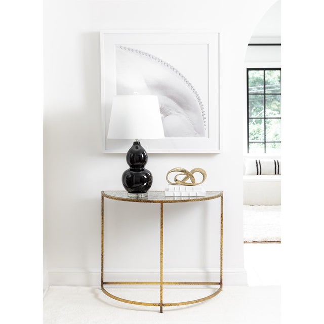 Adding infinite elegance to your home is what the Myriad does best. A continuous loop crafted of solid brass provides a...