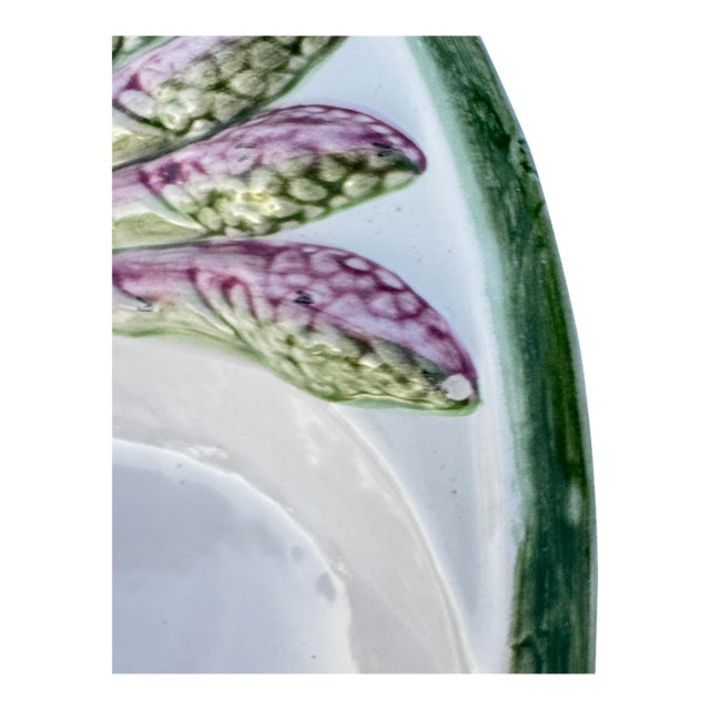 Lovely divided asparagus dish with purple accents. There are two very small chips, these are photographed. One side has...